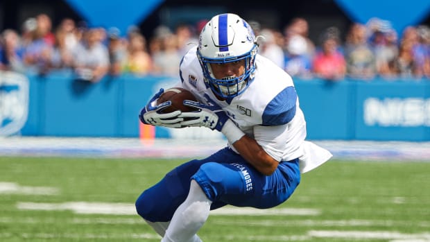 Indiana State Sycamores running back Peterson Kerlegrand (9) runs against the Kansas Jayhawks during the first half at David Booth Kansas Memorial Stadium. Jay Biggerstaff-USA TODAY Sports